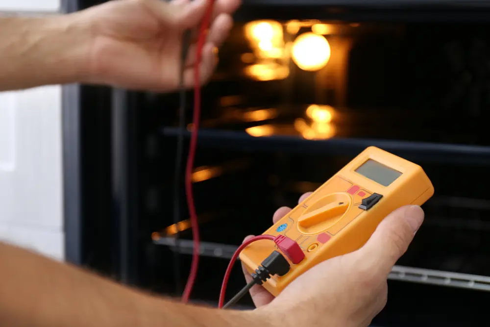 Electrical tester being used to diagnose an appliance circuit