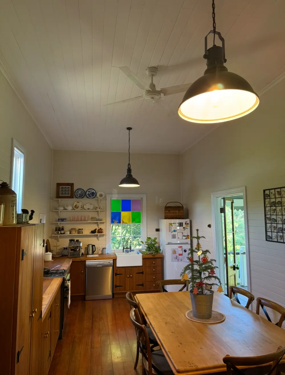 Pendant lighting installed above a kitchen and dining area