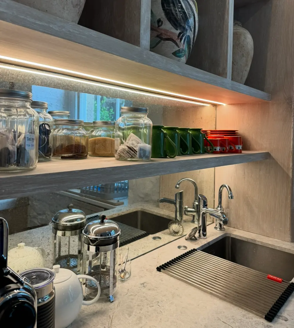 Under-cabinet lighting illuminating a kitchen bench