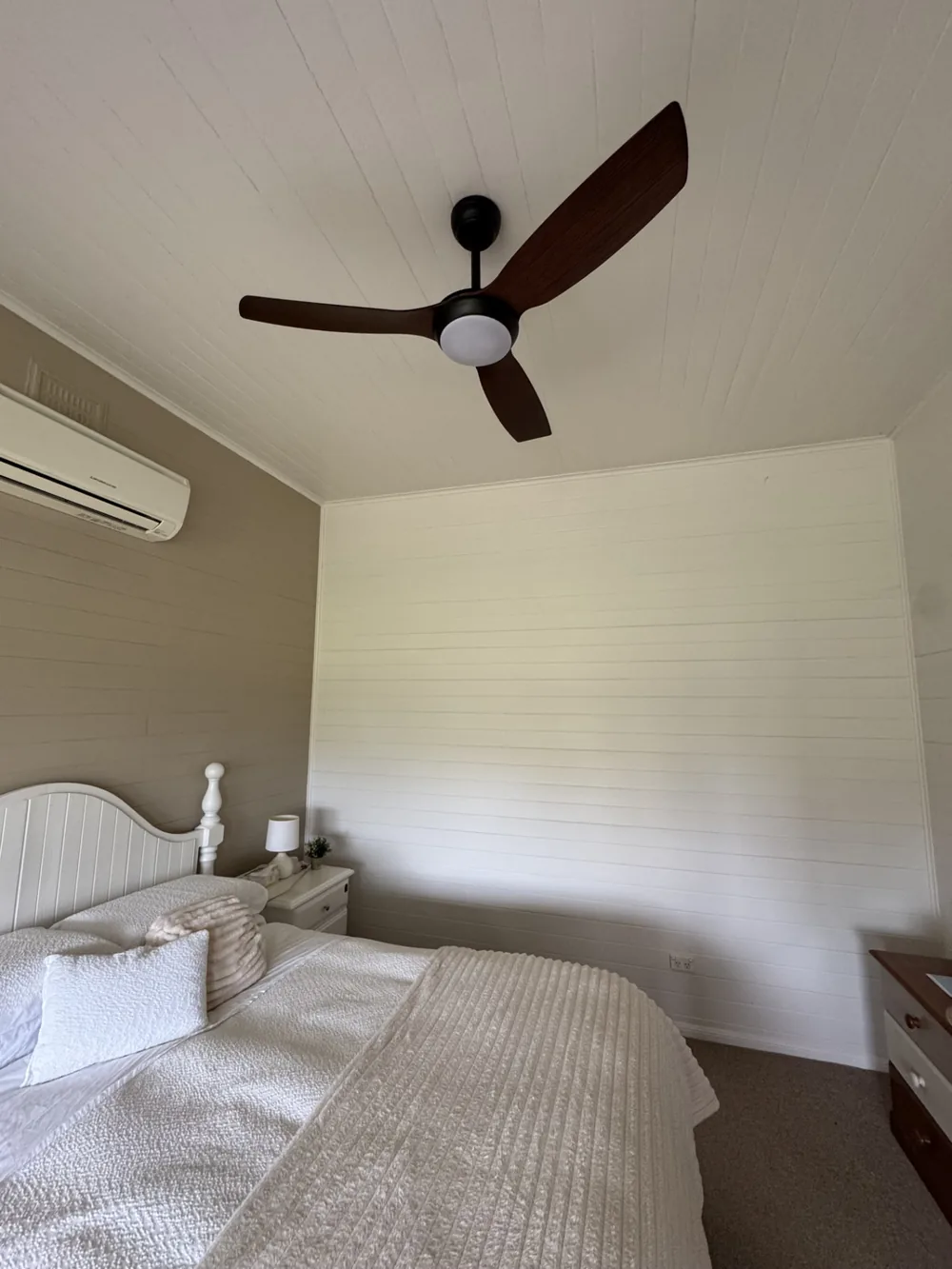 Black ceiling fan and light professionally installed by Ben Wheeler Electrical in a local bedroom.