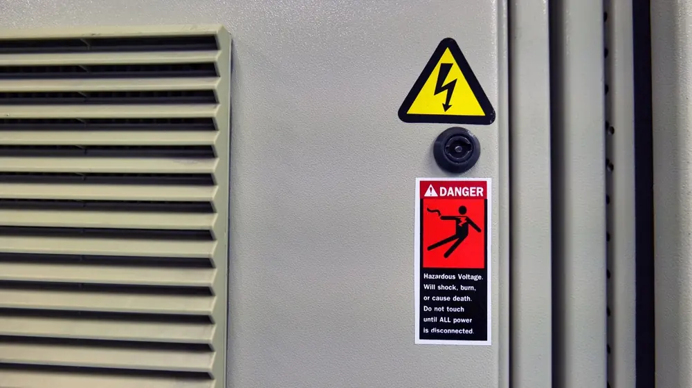 Electrical cabinet with a high-voltage warning sign